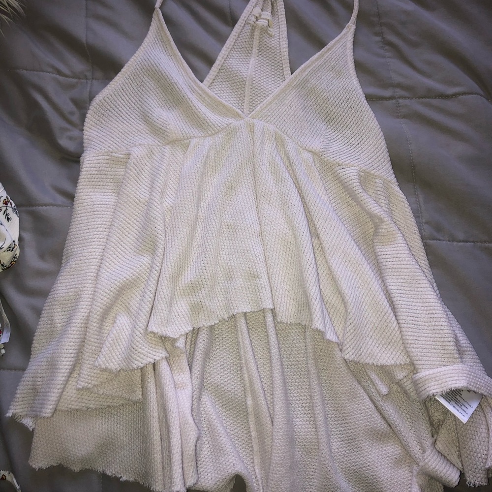 white shirt that is longer in the back